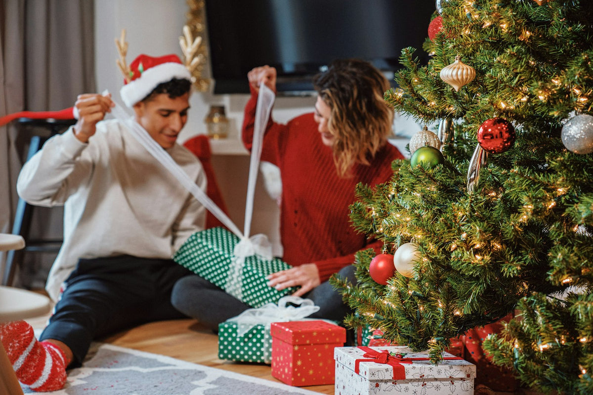 Couple opening Christmas gifts together, ideas for what to get my boyfriend for Christmas