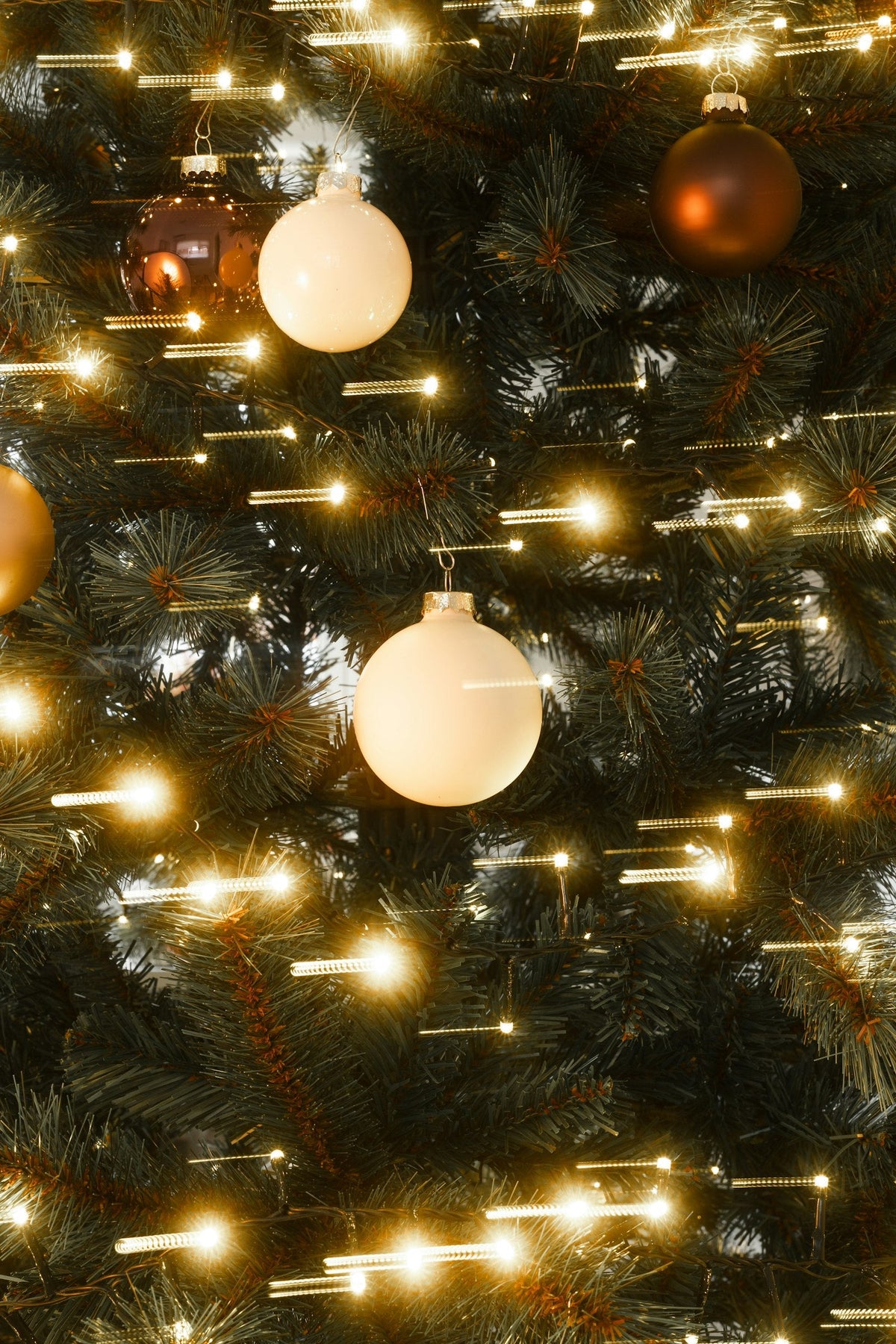 Christmas tree with warm lights and personalized Christmas ornaments