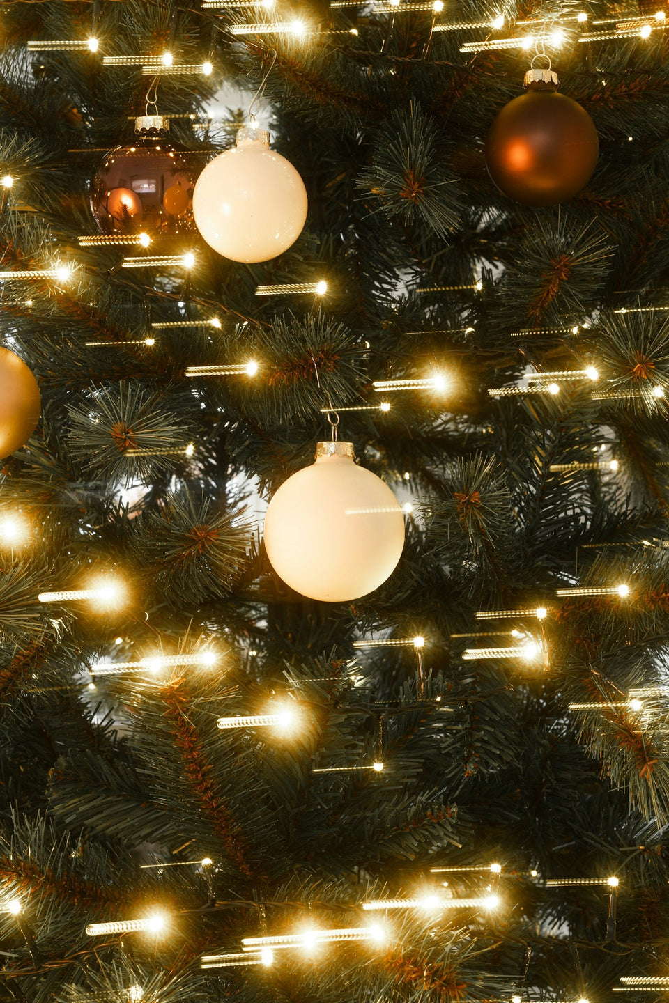 Christmas tree with warm lights and personalized Christmas ornaments